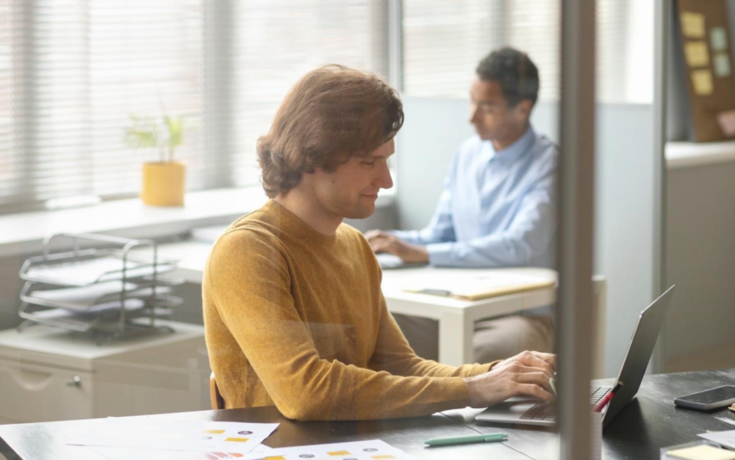 Professional development session with team members reviewing financial presentation strategies